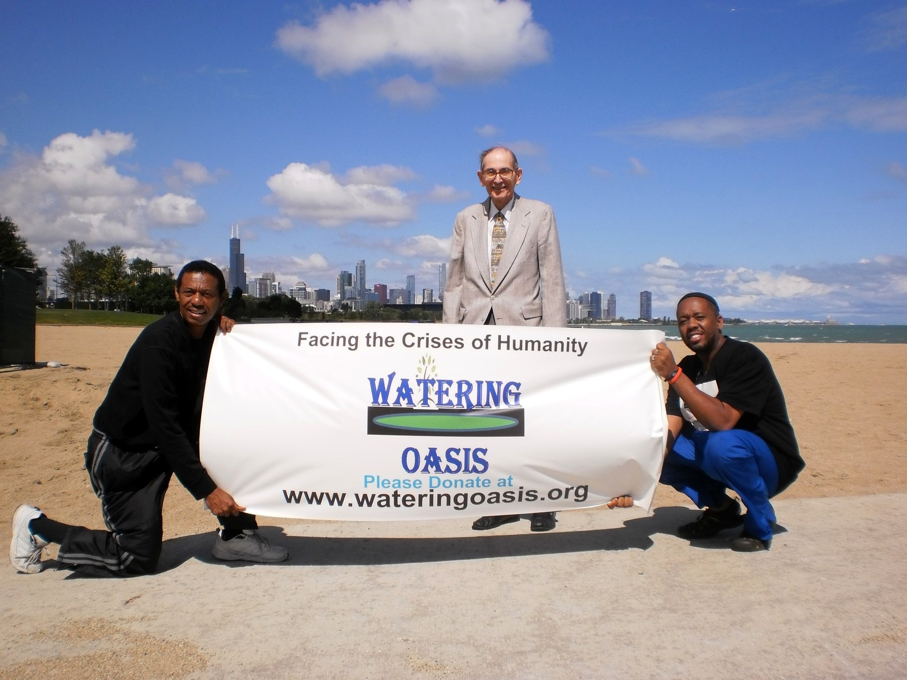 Watering Oasis Global team holding banner in Chicago